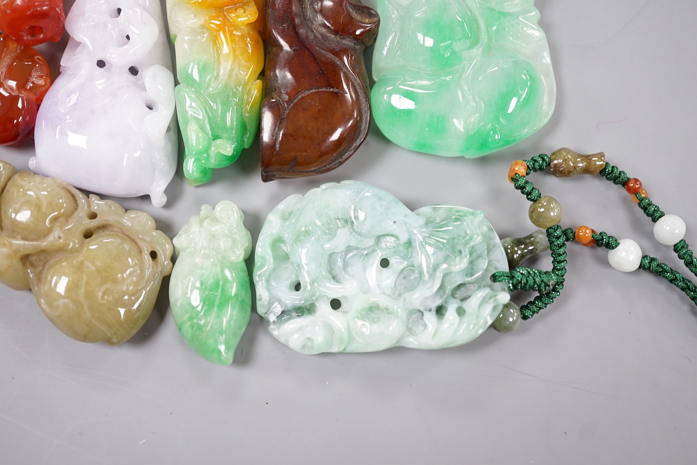 A group of ten jadeite and hardstone carvings and pendants